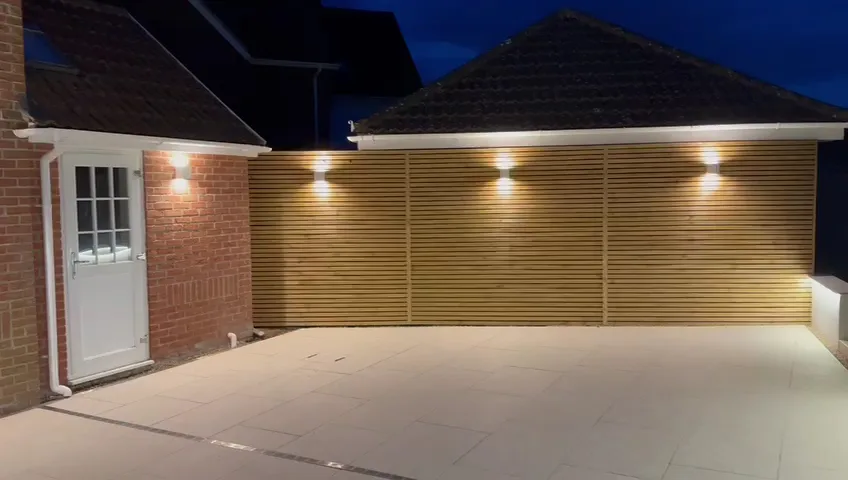 Cedar slatted timber screen with lighting on a porcelain patio in Essex