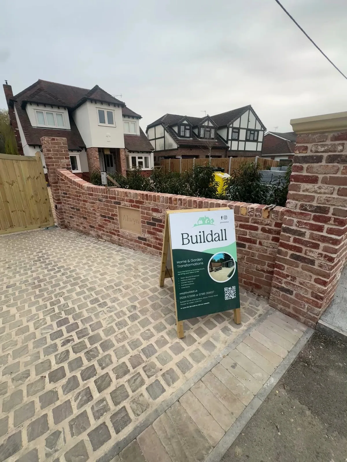 Block-paved driveway with a new brick boundary wall in Essex