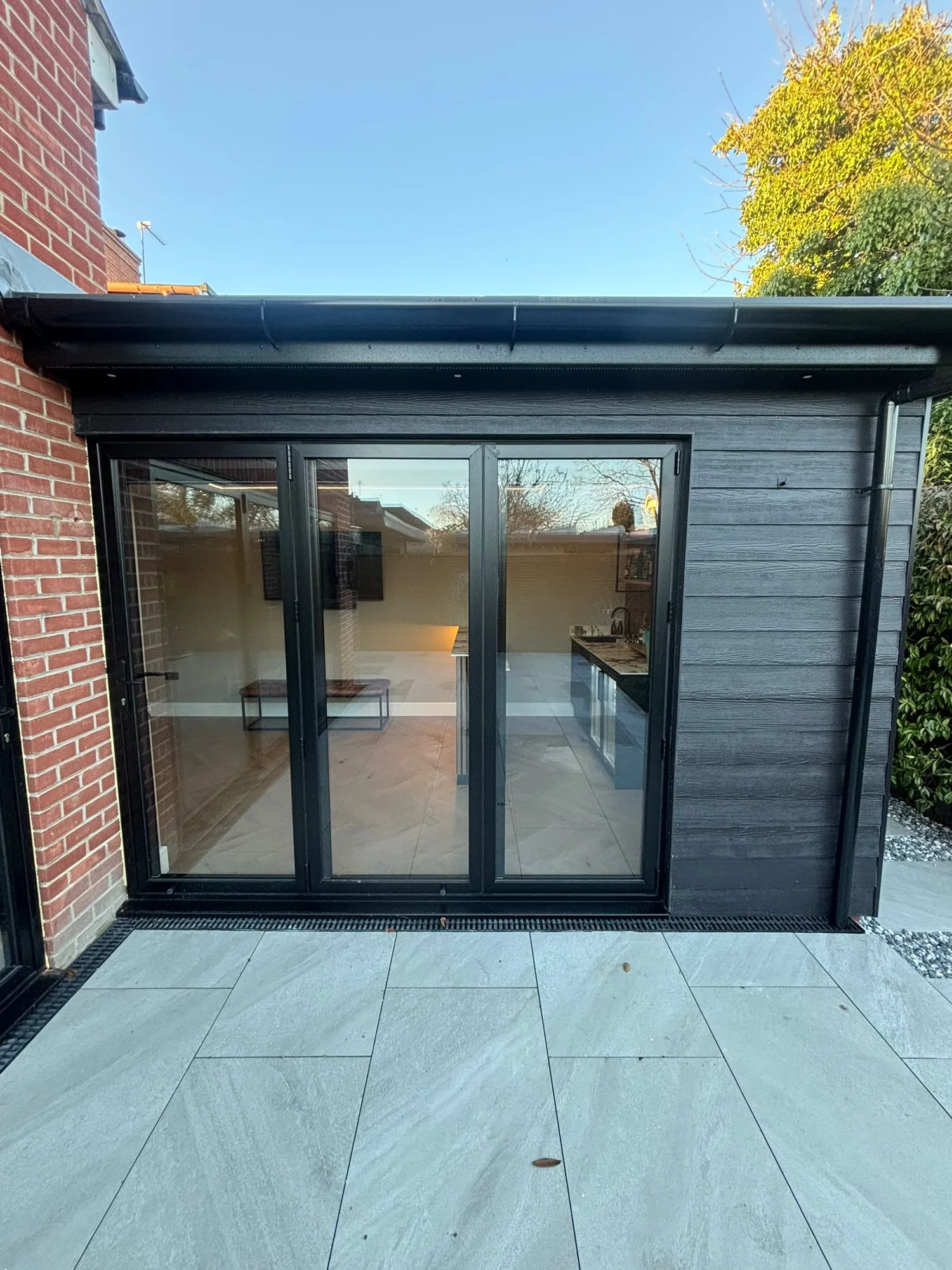 Anthracite bifold doors on a composite clad extension in Essex