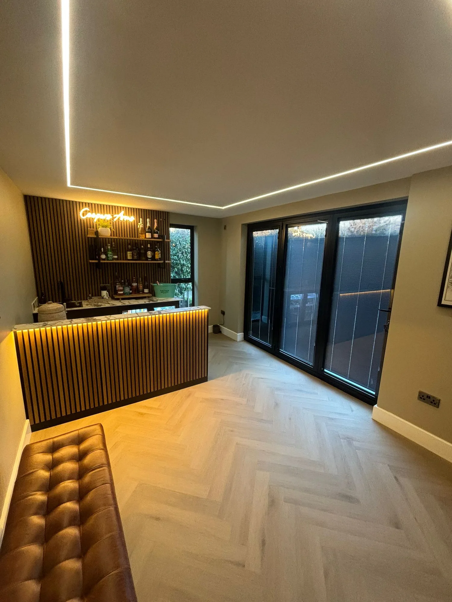 Fitted home bar inside a garden room extension in Essex
