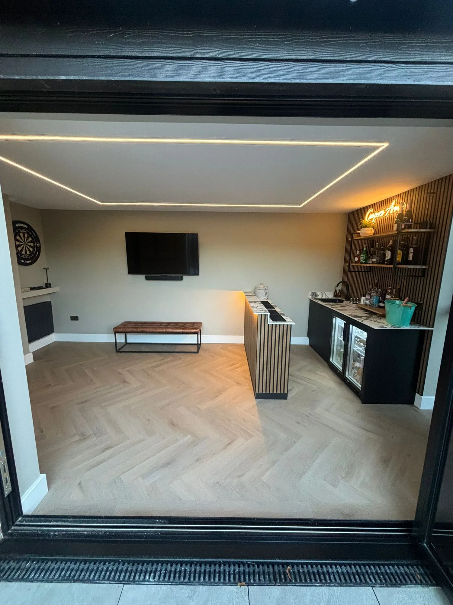 Finished garden room extension lounge and bar interior in Essex