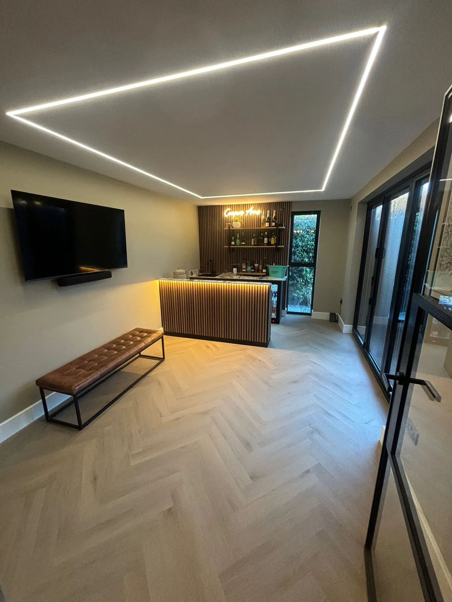 Garden room extension lounge with LED ceiling lighting in Essex