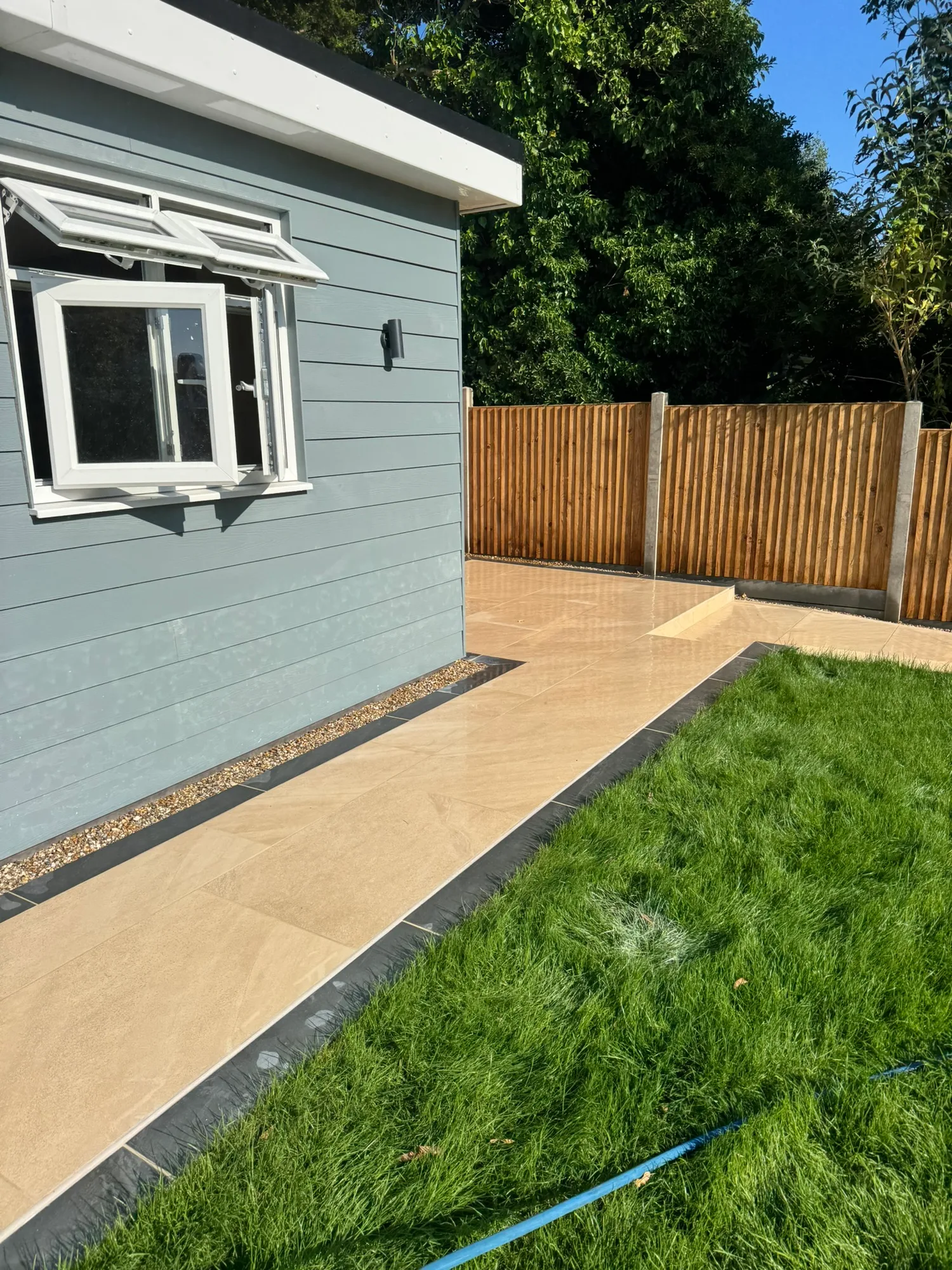 Garden room exterior cladding and porcelain path installed in Essex